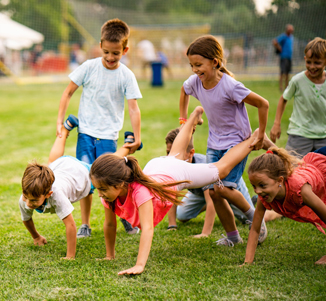 Kids in a human wheel barrow race